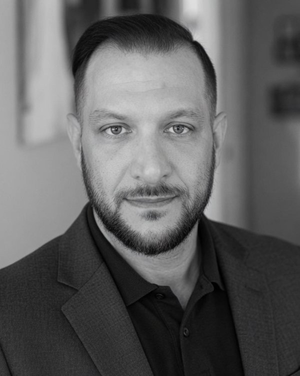 Marcus A. Moore — Co-Founder & CMO, Solveza